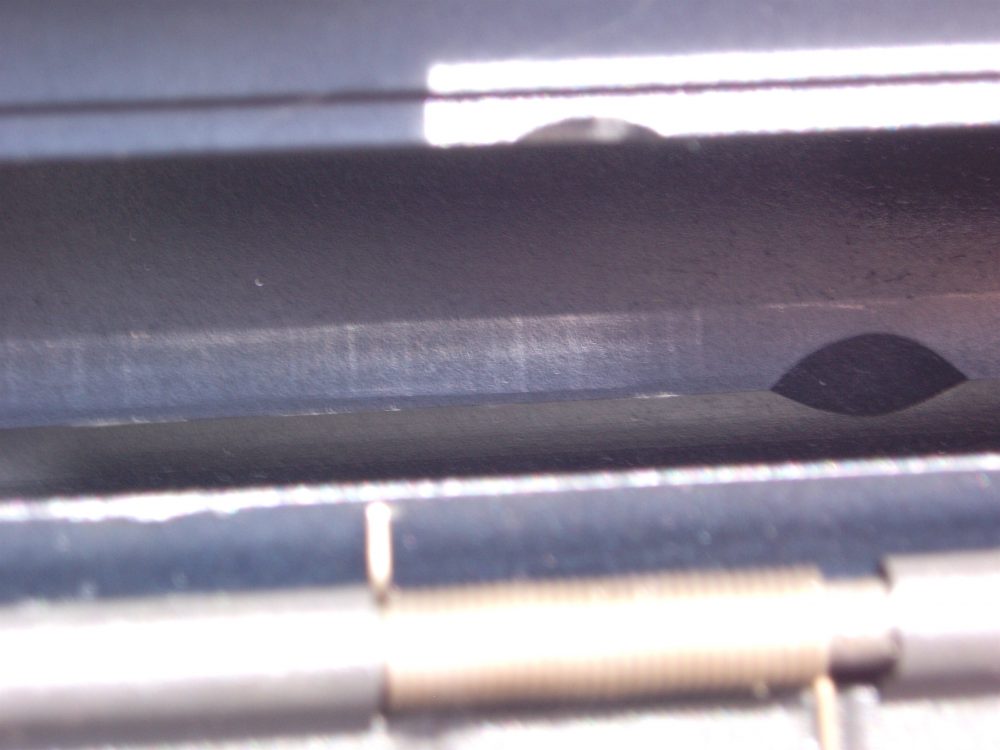 Viewed through ejection port, wear can be seen on inside of receiver.