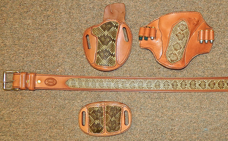 Cuda holster for 1911 with CID magazine pouch and lined 1¾-inch gunbelt and Texas Pancake (top right) for large-frame revolver. Snake skin is from a Mojave rattlesnake—a former resident of Gunsite. 