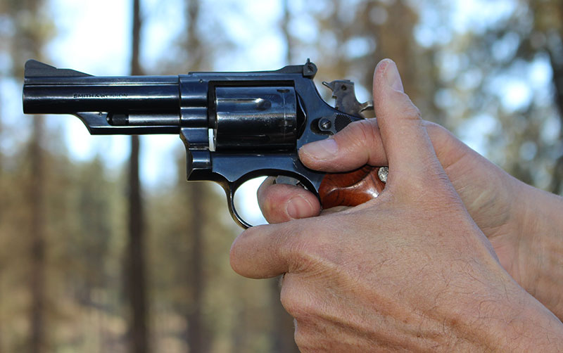 When shooting double-action, author prefers the finger be placed in the “power crease.”