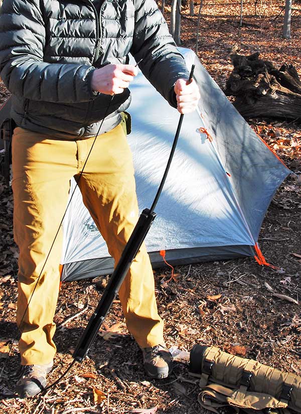 Author demonstrates how a foot on the bottom limb allows the bow to be quickly strung for use or unstrung for storage.
