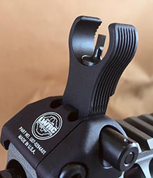 Front sight is adjustable for elevation and has a partial hood to protect front-sight post and reduce glare.