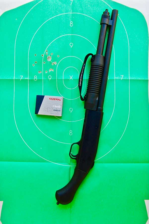 Firing Mossberg Shockwave 20-gauge from the hip takes some practice to determine where to hold, but it patterns well with Federal Classic #3 Buckshot at ten yards.