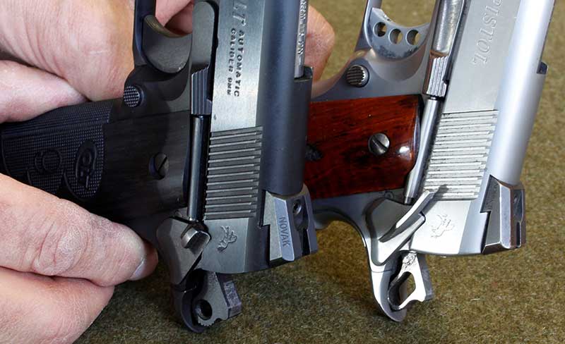Standard small safety on the left, compared to a slightly extended model on Gunsite pistol.