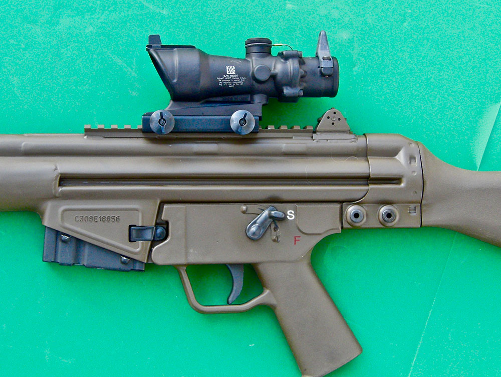 Close-up of TA01NSN-308 mounted. Flip-up sights come standard on C308. Five-round magazine in place ships with C308. In states where legal, two 20-round G3 magazines also come with the rifle.