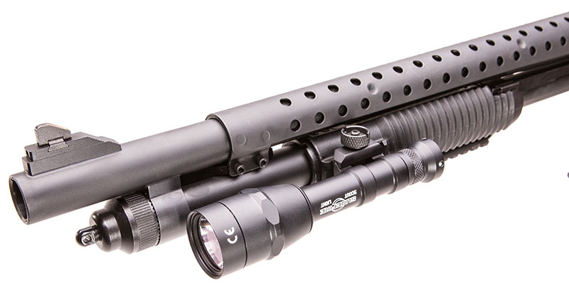 Author mounted SureFire M6001B Mini Scout Light on left forend rail.