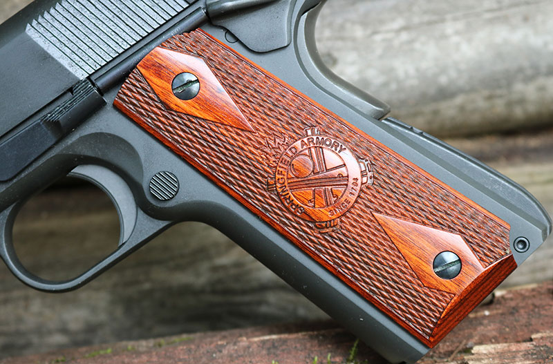 Springfield Armory 1911 Mil-Spec comes with attractive wooden grips. Dabbs’ gun also included spare conservative black plastic grips.