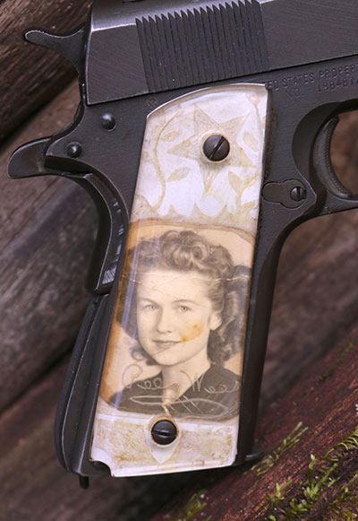 This particular GI 1911A1 includes a priceless right grip crafted by hand and carried by Dabbs’ grandfather-in-law, a decorated WWII Infantryman. He carried this photograph of his young bride through combat in North Africa, Sicily, and Italy.