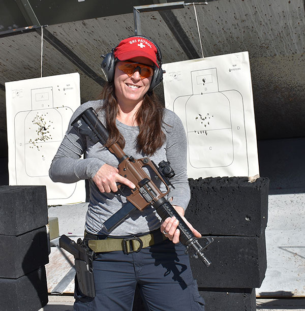 Smile is because of how well she shot—head shots were done in failure-to-stop drills.