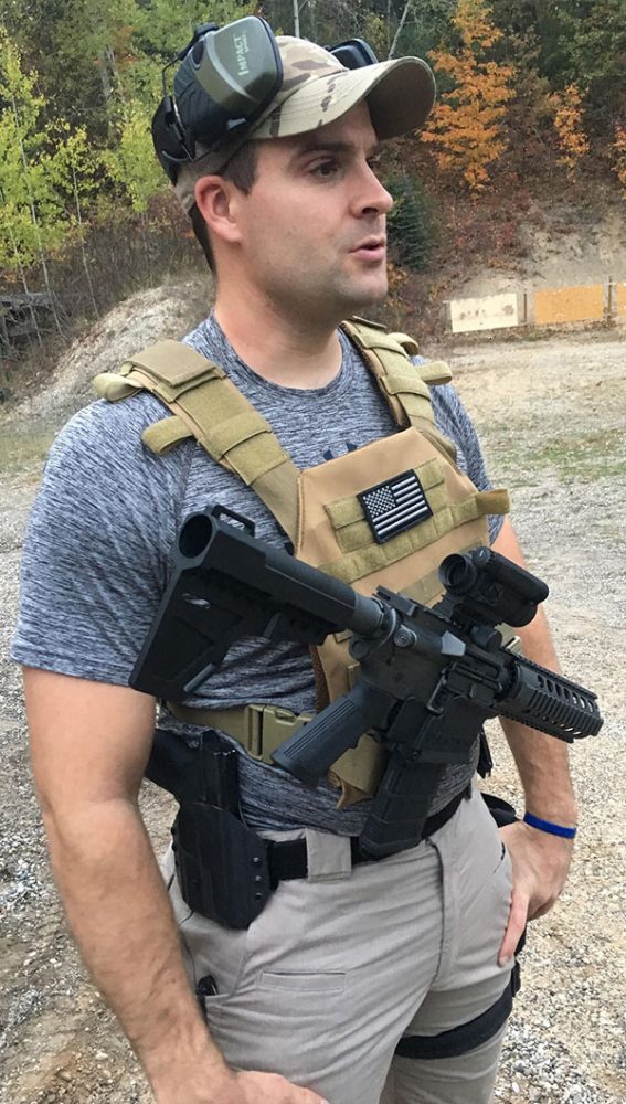 JX Tactical rifle holster fastens into MOLLE loops and releases carbine with push of a button, like a retention holster for a pistol.