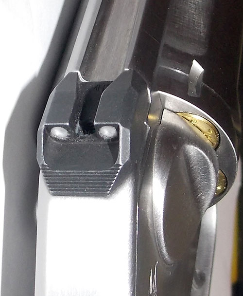 Rear sight is superior to notch milled into top of frame as commonly encountered. It is serrated at the bottom—a nice touch.