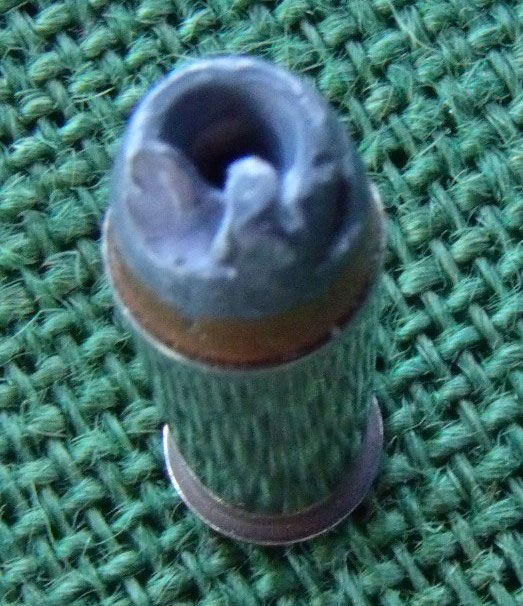 Nose of this bullet was mashed during seating process of loading.