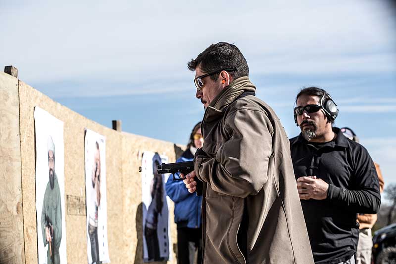 Tanto demonstrates one-hand close-in shooting technique.