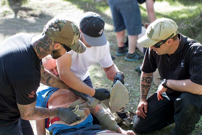 Stoehner supervises students as they care for casualty during a scenario.