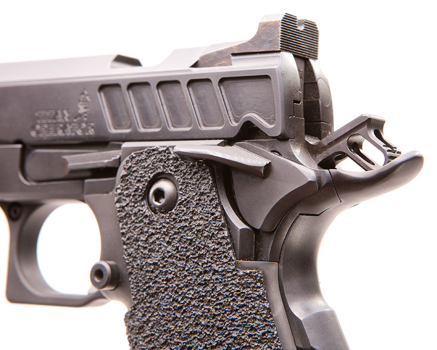 Slotted hammer reduces lock time. Step at front of rear sight enables one-handed malfunction/reload drills.