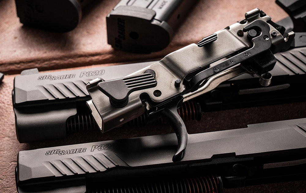 SIG Sauer P320’s fire-control chassis houses ambidextrous slide catch lever, trigger bar, trigger, hammer, slide rails, and associated springs. Chassis allows for modularity of design and is serialized number component of the design.