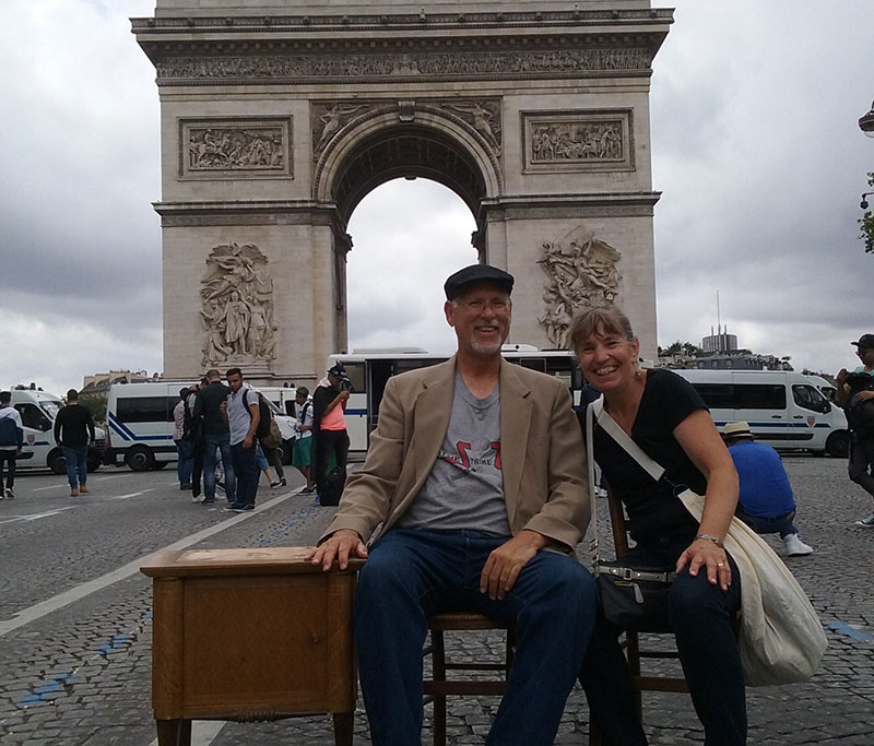 Geez, tourist! Sitting down to have your picture made at the Arc de Triomphe. Champs-Élysées is often closed to traffic, but not always.