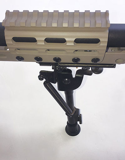 UNS (night vision) is mounted forward on the barrel. Slots are M-LOK compatible.
