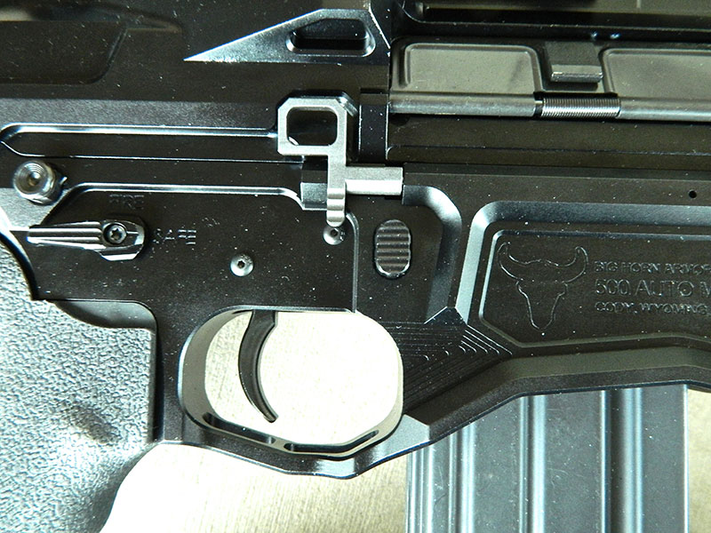 Right side of receiver shows ambidextrous bolt release and safety. Rifle features enlarged trigger guard.