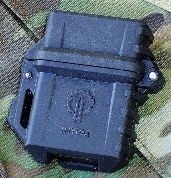 Thyrm PyroVault is designed to “up-armor” the classic Zippo lighter for outdoor and survival applications. It’s made of rugged polymer and is PALS/MOLLE compatible.