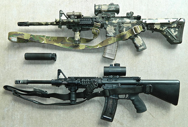 Author’s .22 Olympic Arms subcaliber trainer (bottom) is set up exactly the same as his Bravo Company work gun, with the exception of a cheap red dot sight instead of an Aimpoint. They can use the same SureFire suppressor.