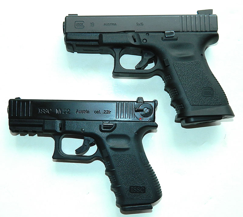 With the exception of the manual safety added due to import restrictions, ISSC M22 (bottom) looks like and mimics the feel of the Glock 19.