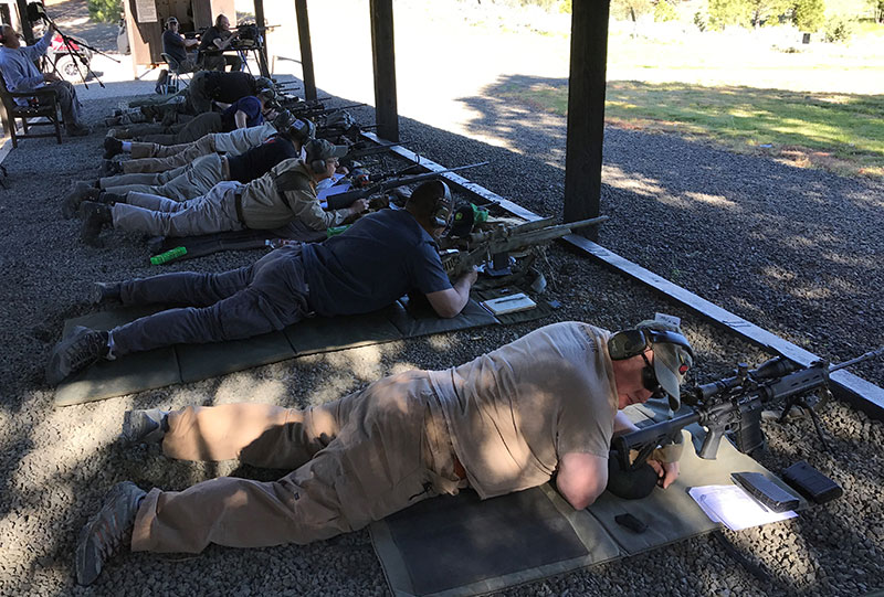 On the firing line at Thunder Ranch. Clint Smith is seated at top left.