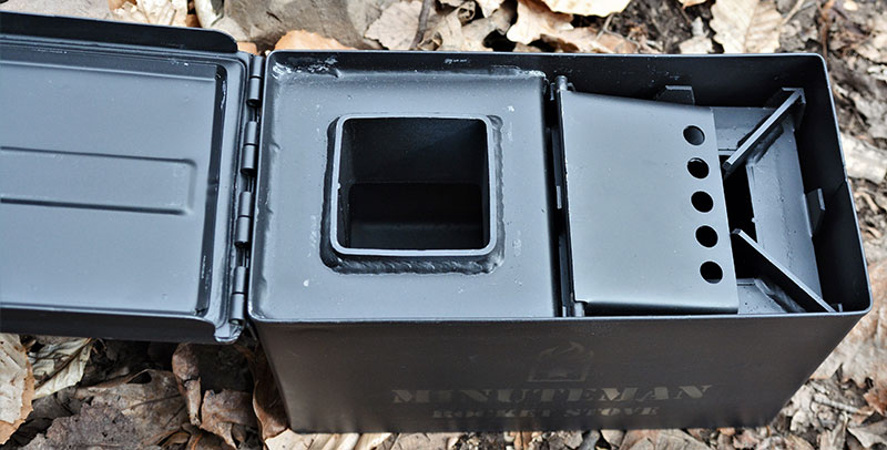 Once everything is packed away inside, lid of Minuteman Rocket Stove can be placed on top. Even with burner placed inside burn chamber, there is plenty of room to store next fire's tinder bundle.