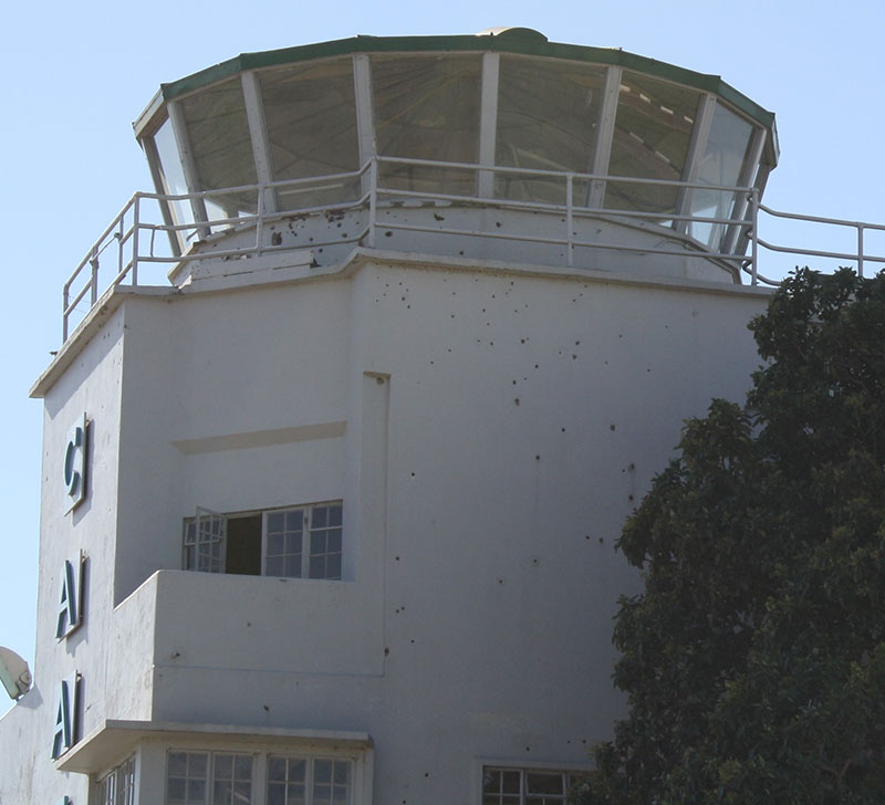 First documented operational use of NFDD was by Israeli commandos during raid at Entebbe in 1976. Bullet holes from raid are visible in old terminal building of Entebbe International Airport. Photo: U.S. Army photo by Lt. Col. David Konop / Released