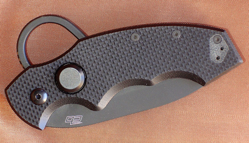 Colonel Folder has a push-button sleeve liner lock. Finger ring also acts as a flipper to deploy the blade.