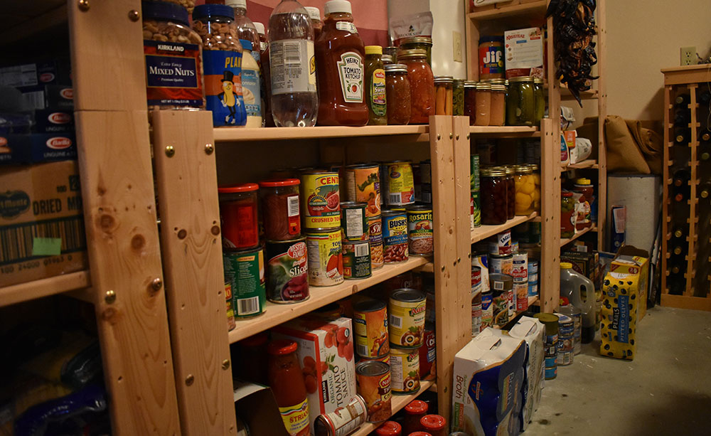 Portion of author’s pantry, with home and commercially canned food.