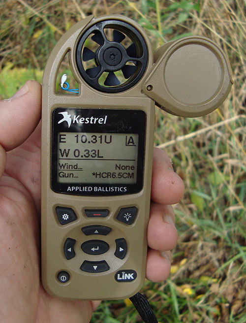 Solution in hand: Kestrel reads wind and atmospherics, runs them and other factors with Applied Ballistics program, filters inputted caliber and firearm specifics through them, and provides reliable firing solution. First-round hit probability is greatly improved over seat-of-the-pants method.