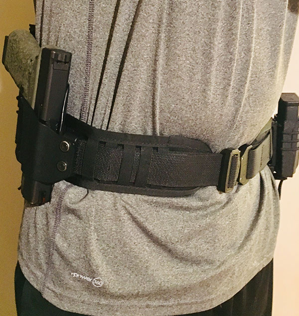 Minimalist Belt Pad worn over gym shorts and t-shirt. It can be quickly donned and makes it easy to keep defensive tools in close proximity.