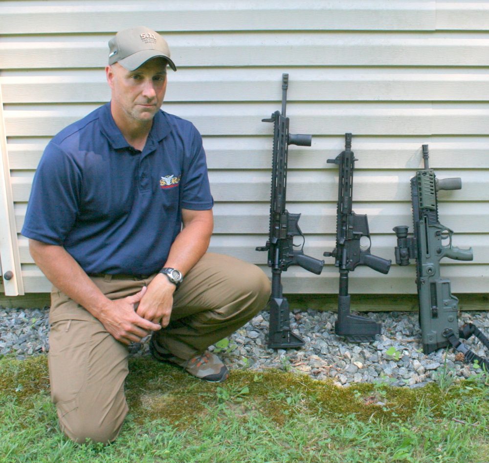 Former U.S. Air Marshal Ken Trice shows overall length differences among (left to right) 16-inch barrel SAINT AR rifle, nine-inch barrel SAINT .300 BLK pistol, and 16.5-inch barrel Tavor X95 Bullpup rifle. Bullpup would solve subcompact rifle’s loss of muzzle velocity, reduction in engagement range, and terminal effectiveness while retaining high degree of maneuverability at close quarters.