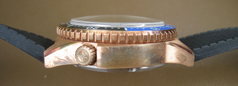 Side view of Zelos Mako Bronze Diver watch shows off rugged look with nice patina.