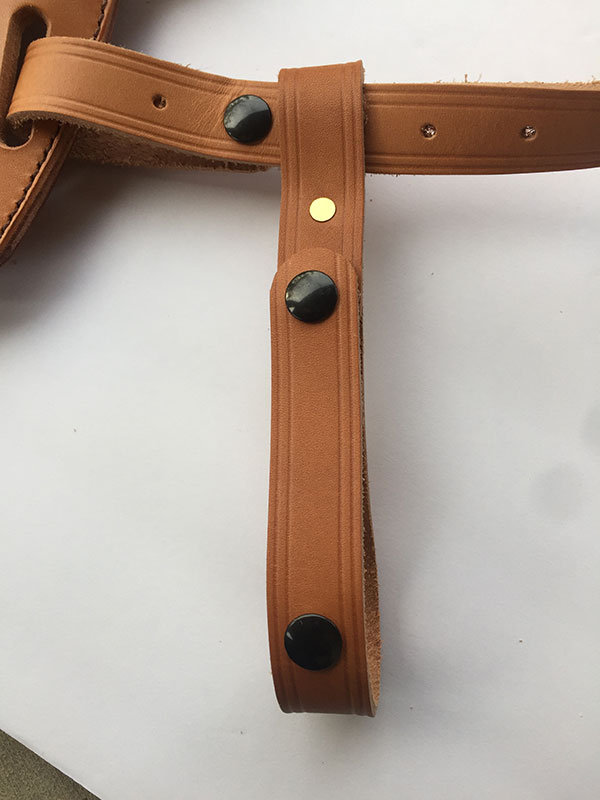 Loop with snaps attaches to waist belt to keep system in place.