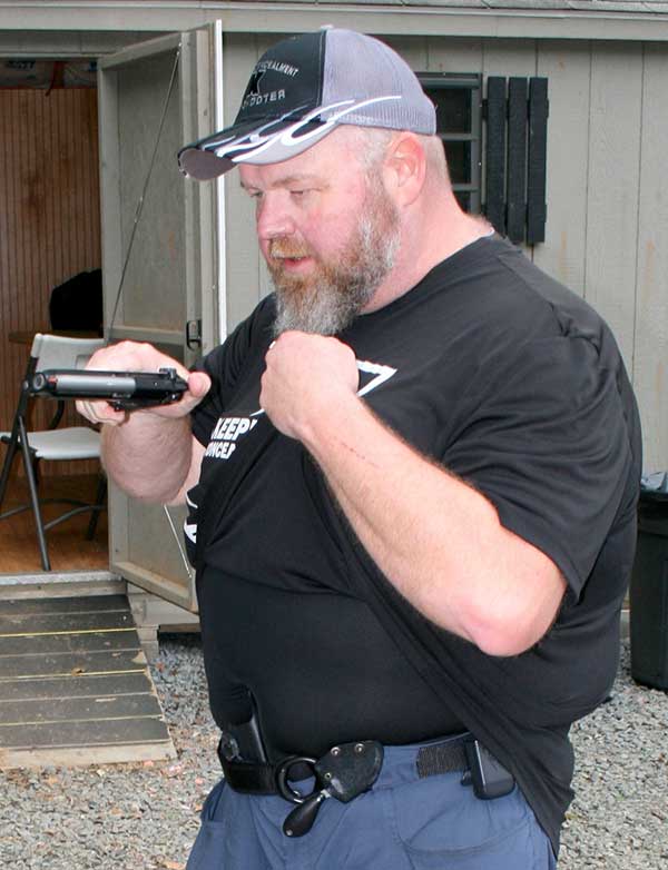 Gun comes back to holster same way it went up. But with trigger finger in register and thumb on hammer, pistol is rotated 90 degrees inboard and brought to the exposed holster.