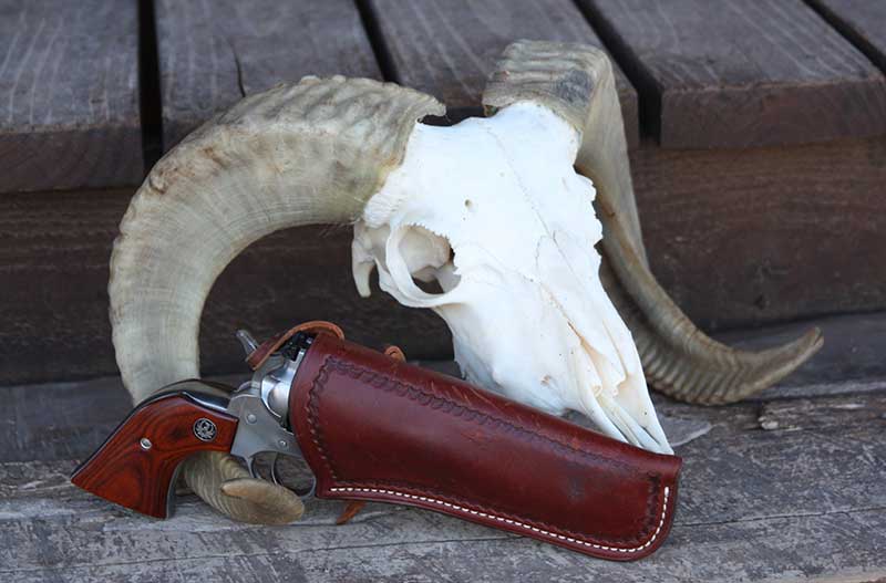 Skull borrowed from Dunton Ranch is for show, but Ruger Single Seven housed in a Baranti holster is the real deal for a great trail gun.