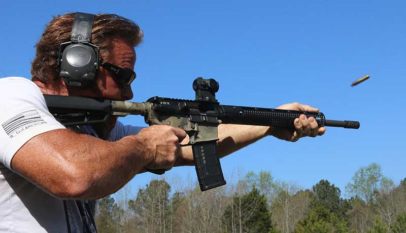 Pat MacNamara firing rifle a year and about 3,500 rounds after its initial lubrication.