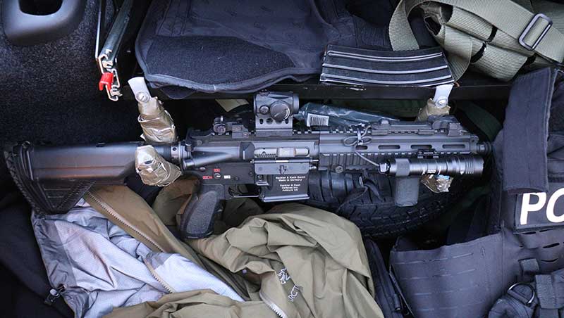 Local PD Special Reaction Team uses short HK416s with Aimpoint T1s. Operating in suburban area where most action takes place inside structures with little chance of shooting beyond 100 yards even outdoors, their choice of a short carbine with just a red dot makes perfect sense.