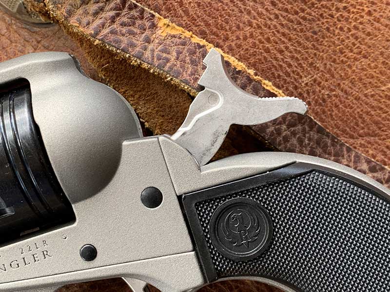Weight-reducing cutouts on both sides of hammer.