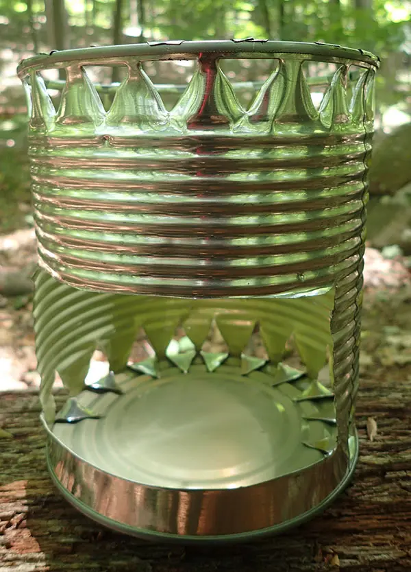 Hobo stove made from large string-bean can using tin snips, can opener, and Swiss Army knife awl.