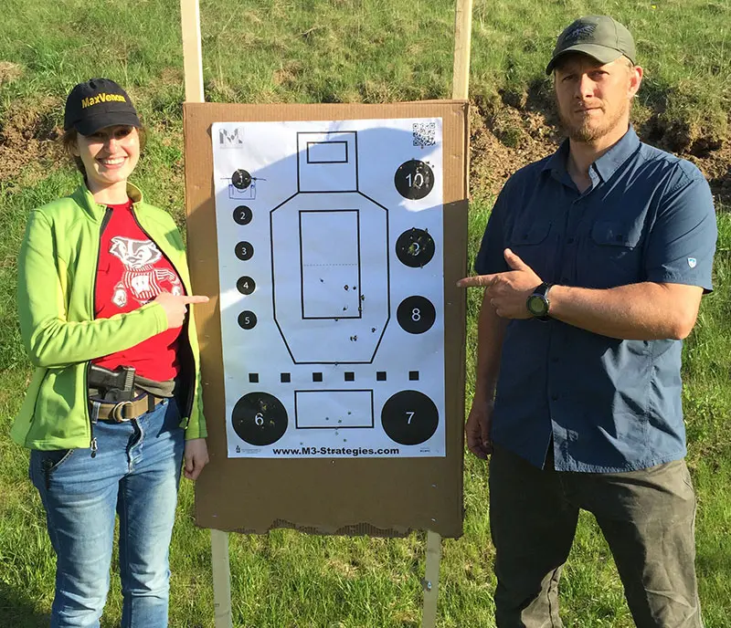 Author shows off her target with lead instructor Bill Rapier.