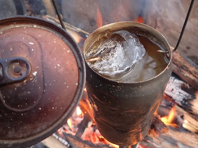 Fosters cook pot with wire hanger bail. Any soda or beer can is useable, but Fosters beer can is very rigid compared to others.