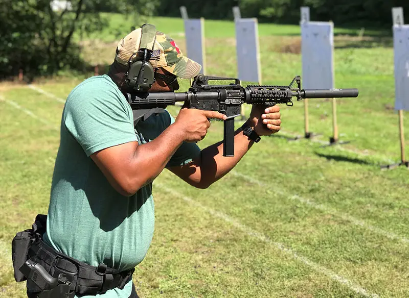 Lt. Reggie Jackson fires Colt SMG with GSL Scorpion suppressor.