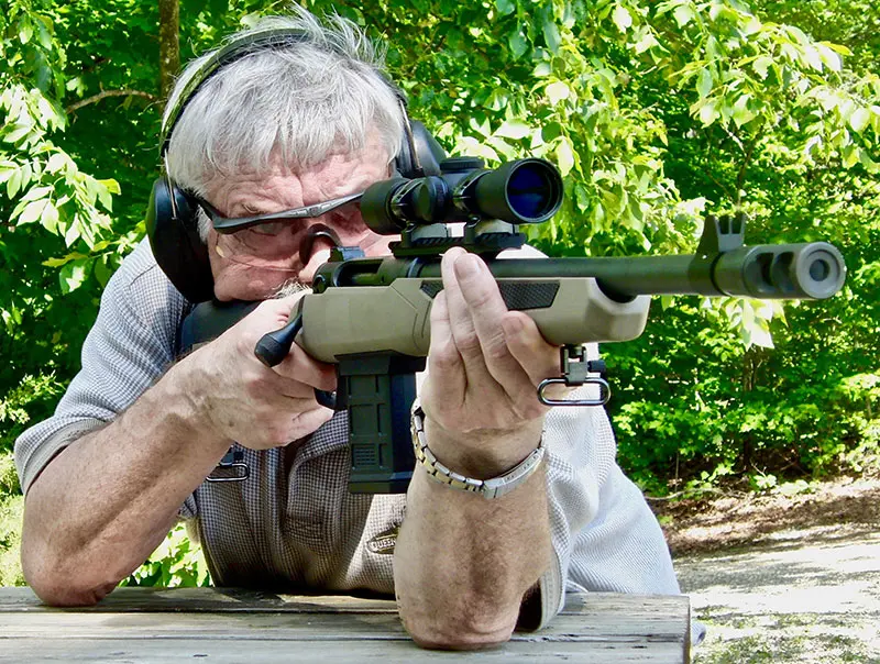Thompson shoots from standing rest at 100 yards.