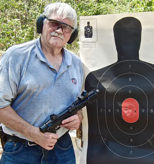 Good shot placement is possible at ten yards when bracing Inland .30 Carbine pistol on vehicle window edge.