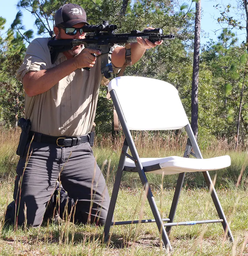 First position is High Kneeling shooting over simulated cover.