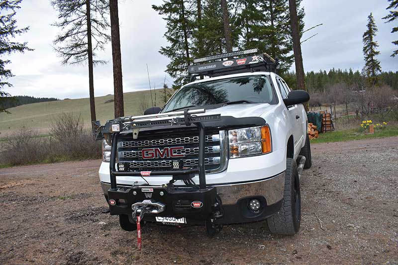 Warn Trans4mer mount holds the winch, lights, and Hi-Lift jack.