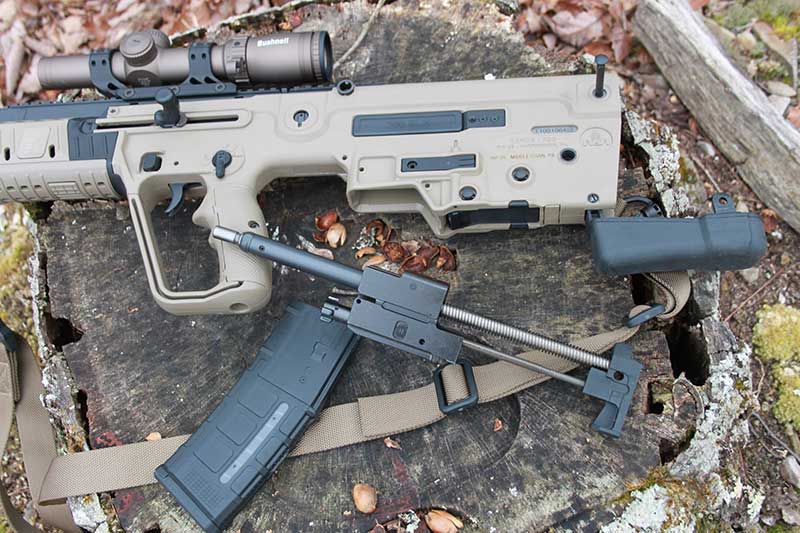 IWI Tavor X95 disassembles quickly with long-stroke gas piston and bolt group removed by unhinging rifle’s buttstock and pulling out bolt group assembly.