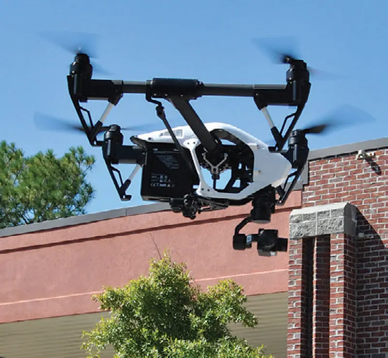 About-seven-feet-off-the-deck,-DJI-Inspire-1-drone-slows-to-a-hover
